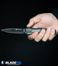 Smith & Wesson M&P OTF Spring Assisted Spear Point Knife Gray (3.5" Black) -Knives Store SmithWesson OTF Assist Finger Actuator Spear Point Knife Black BHQ 67476 kp in hand web large